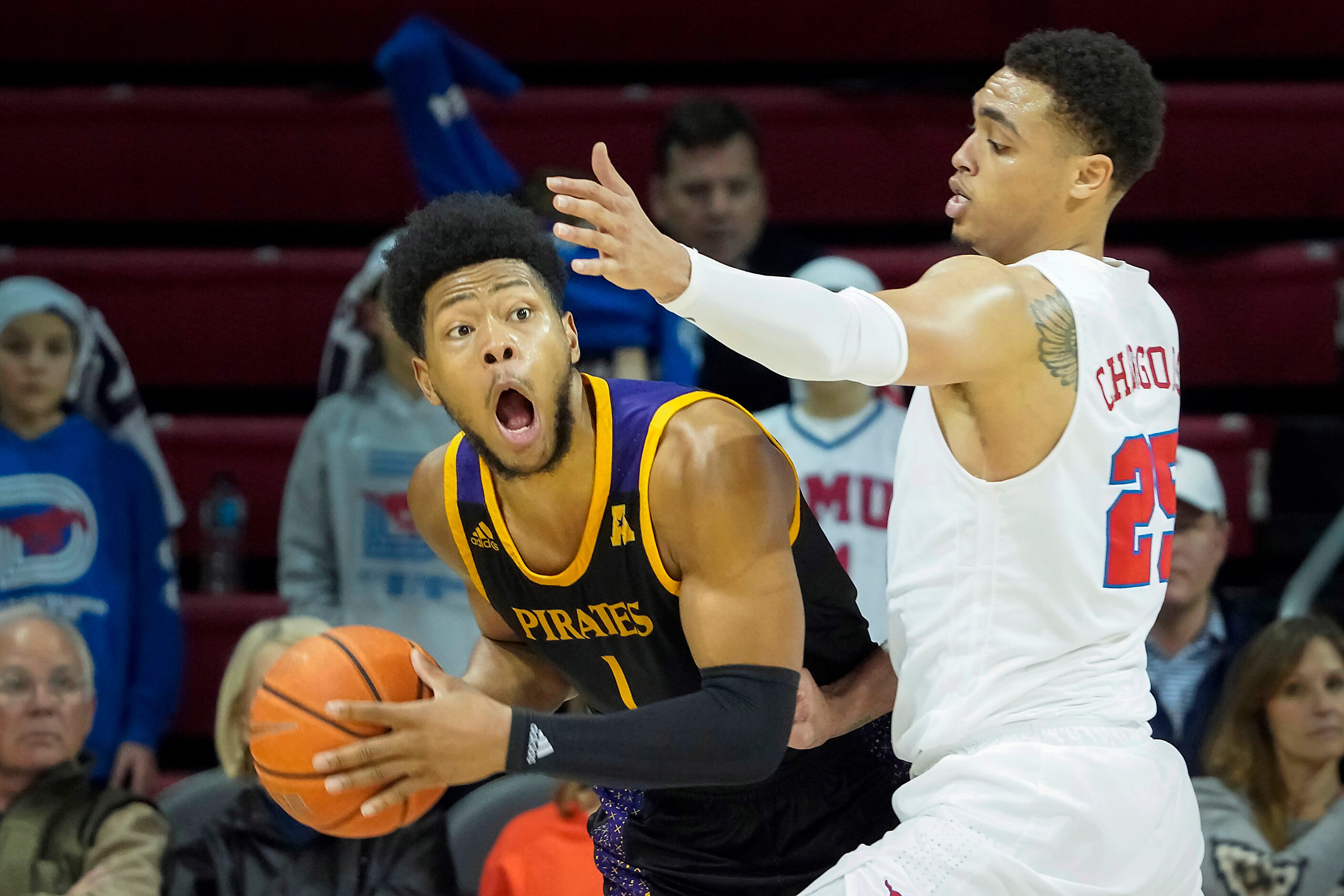 East Carolina forward Jayden Gardner (1) tries to pass around SMU forward Ethan Chargois...