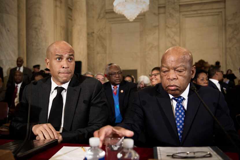 Rep. John Lewis, D-Ga., (right) with Sen. Cory Booker (AP Photo/Cliff Owen)