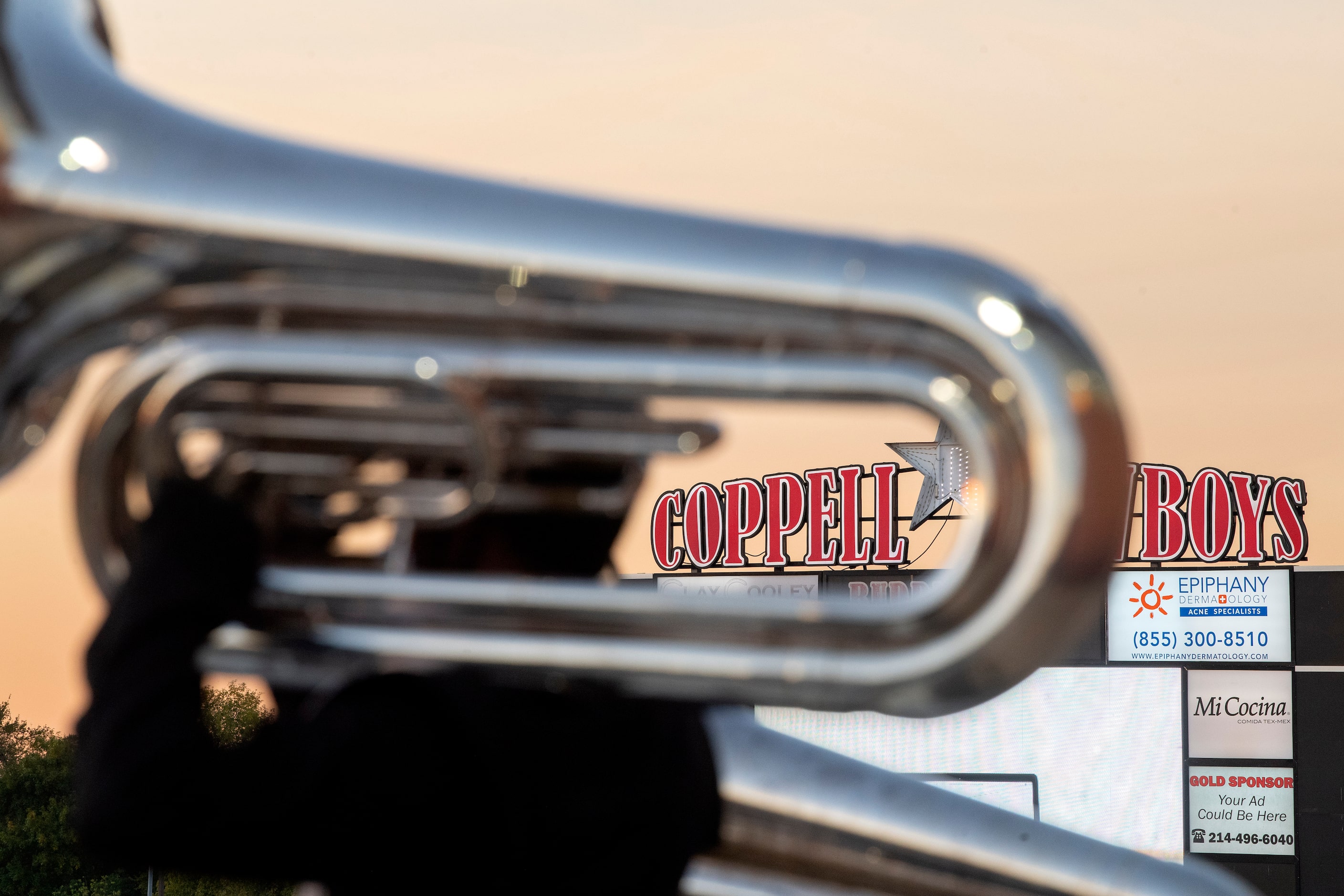 The Coppell band warms up before a high school football game against Plano West on Friday,...