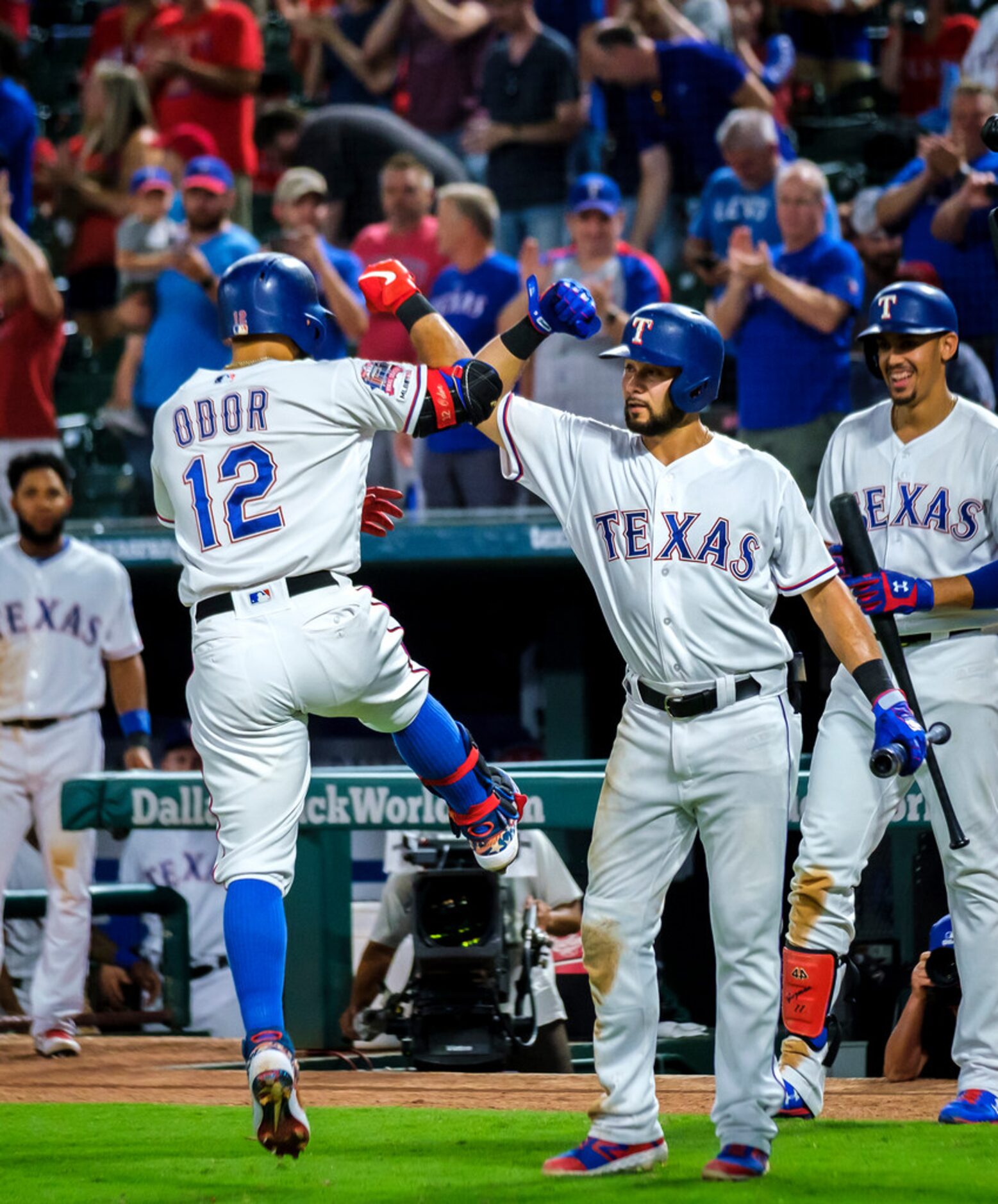 Texas Rangers second baseman Rougned Odor celebrates with third baseman Isiah Kiner-Falefa...