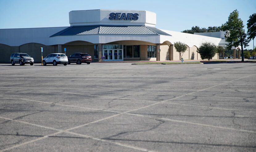 A few cars in the parking lot of a Sears at Richardson Square in Richardson, Texas on...