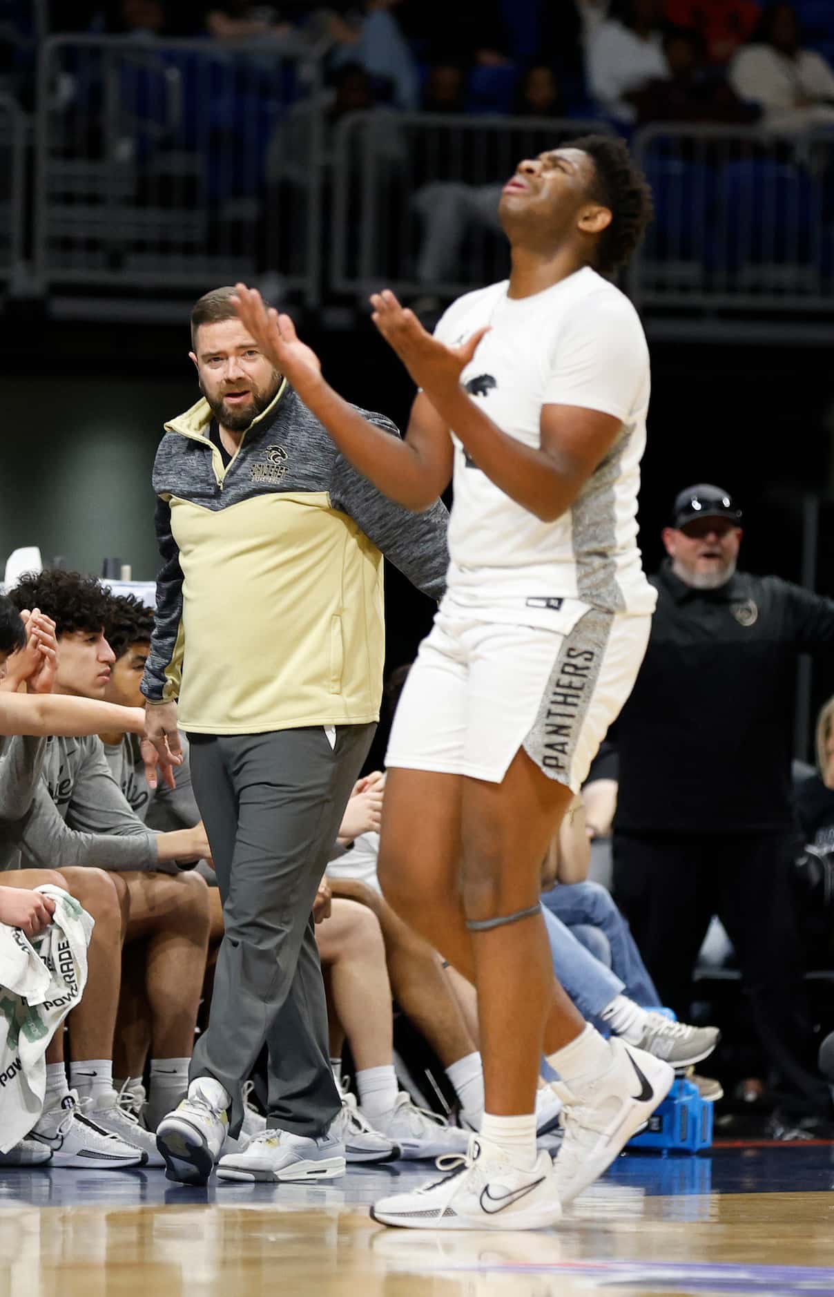 Plano East head coach Matt Wester watches as DJ Hall (0) reacts to a foul during the UIL...