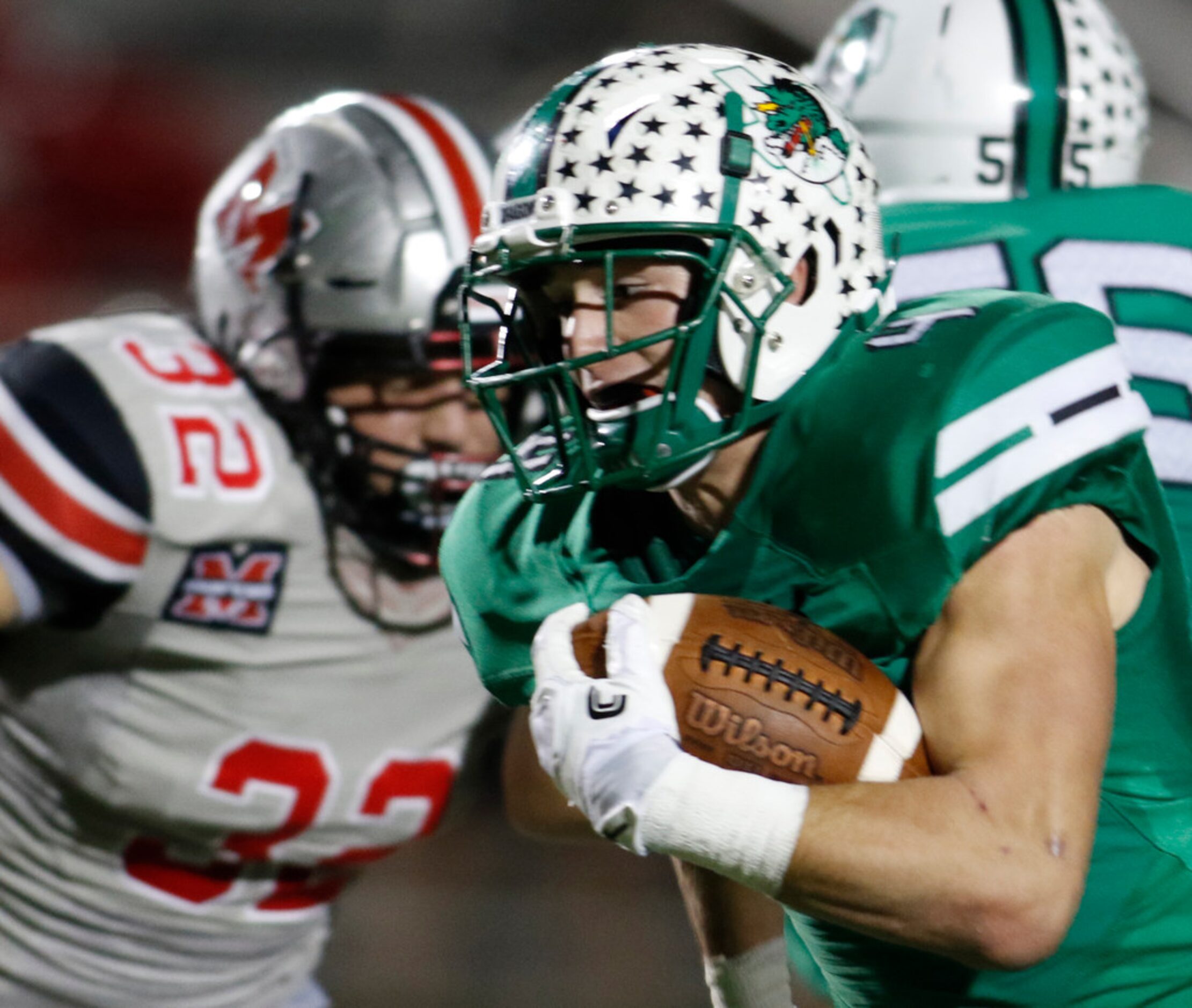 Southlake Carroll running back T.J. McDaniel (4) is "off to the races" as he scampers past...