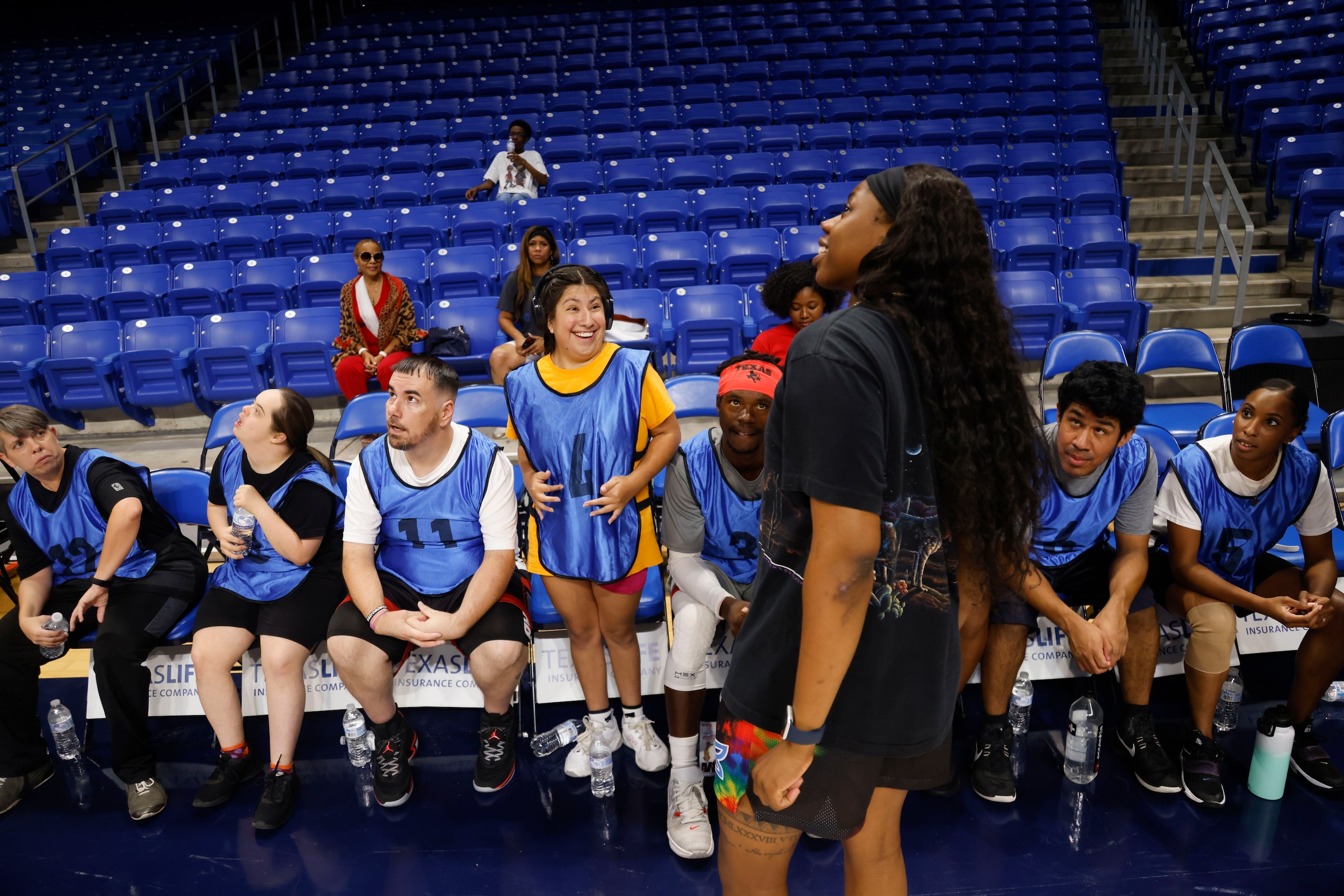 Team Arike’s Miranda Estrada (4) listens to coach Arike Ogunbowale in a timeout during a...