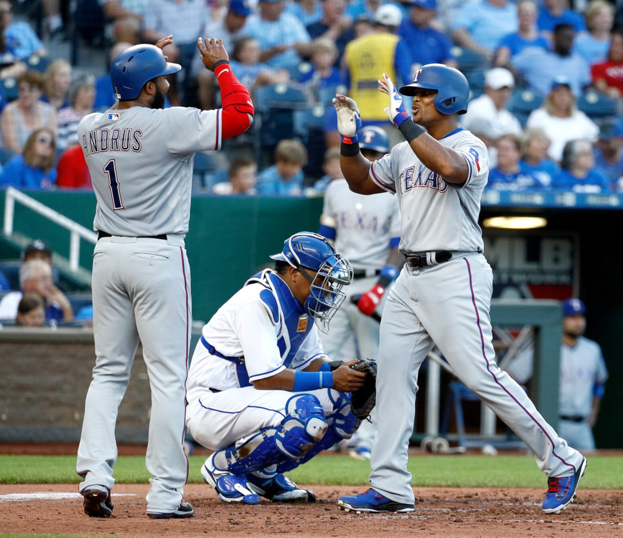 Texas Rangers' Adrian Beltre, right, celebrates with Elvis Andrus (1) after hitting a...