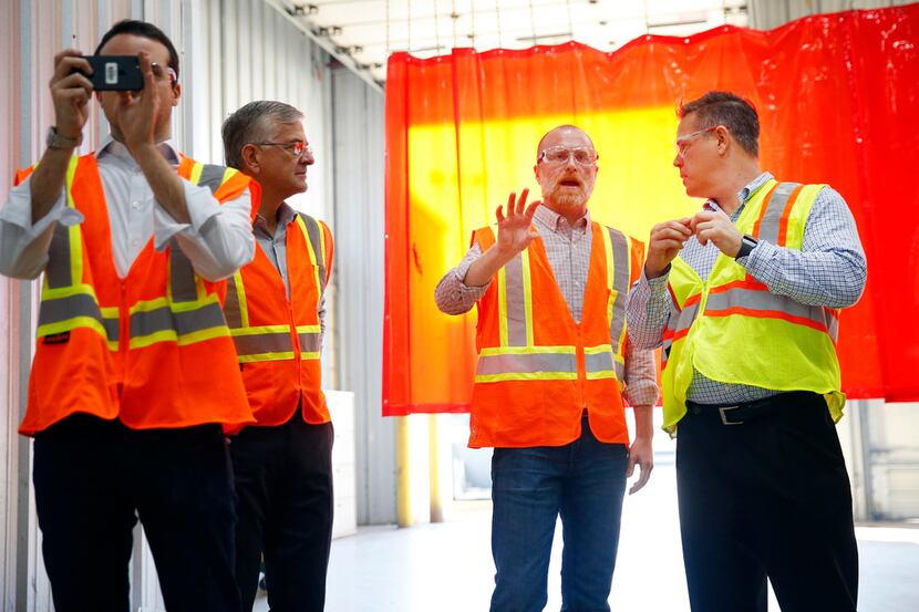 Federal Communications Commission member Brendan Carr (second from right) tours wireless...