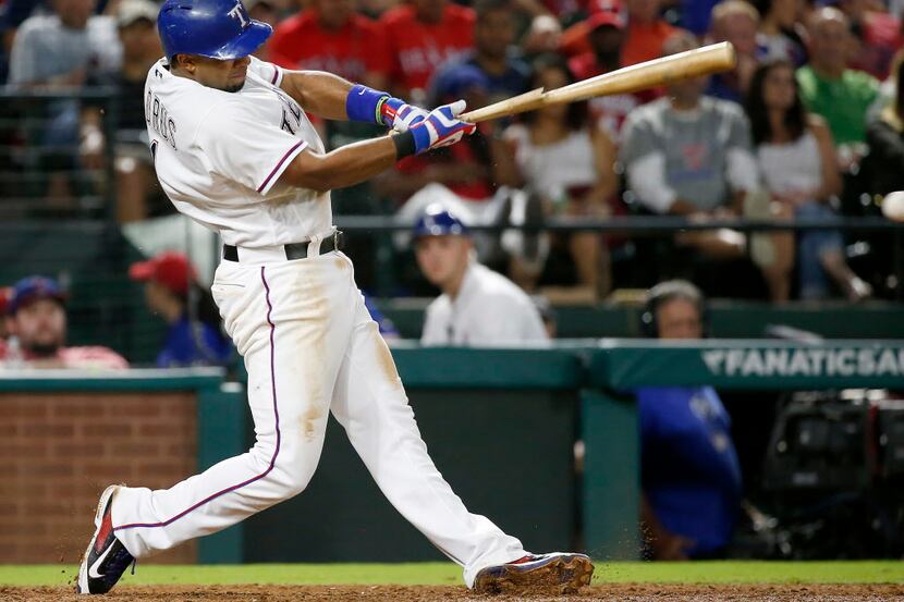 Texas Rangers shortstop Elvis Andrus breaks his bat as he sounds out during the 6th inning...
