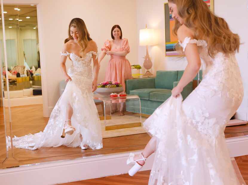 Soon-to-be bride Lauren Garcia of Dallas shows off her high heels, joking that she needs...