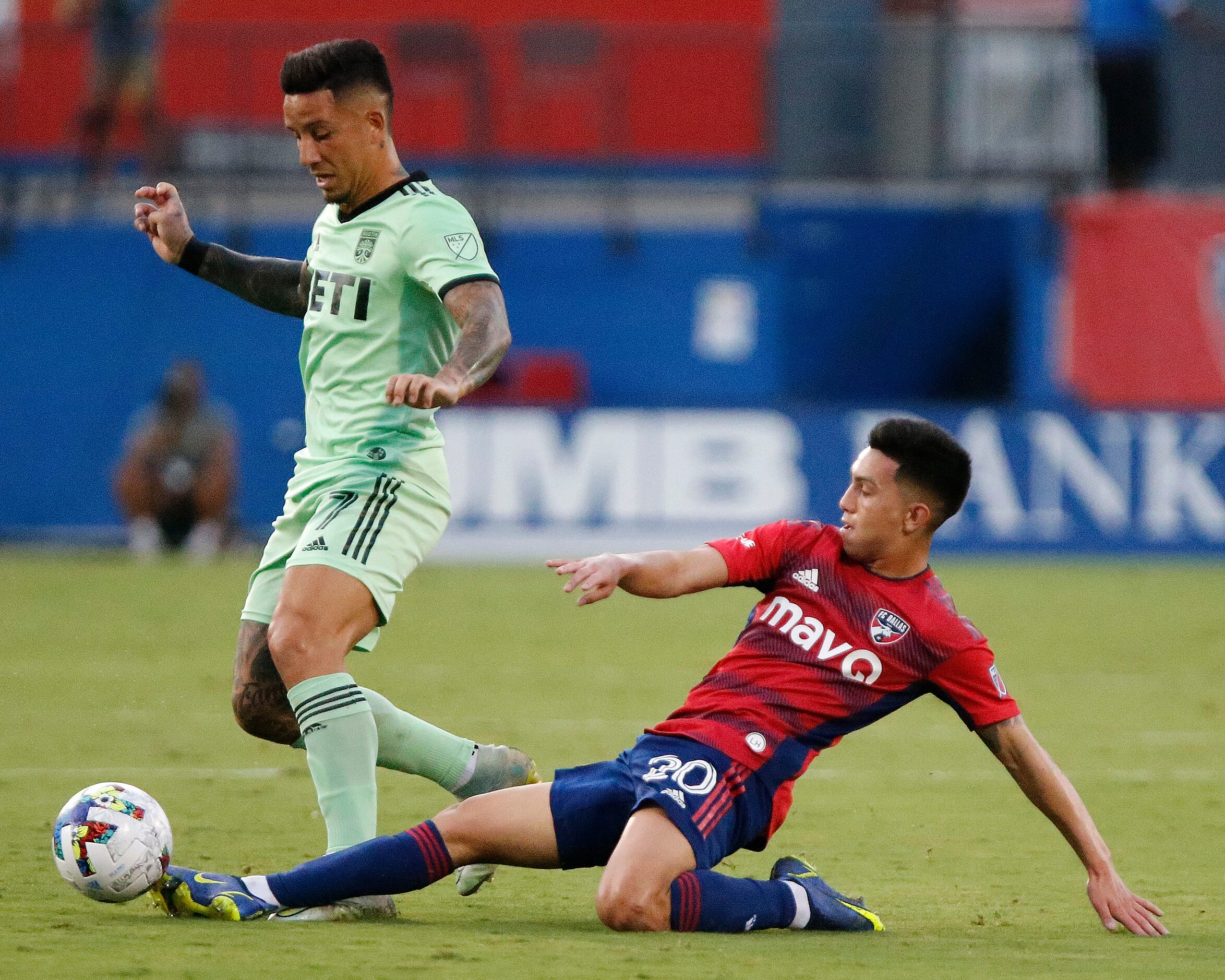 FC Dallas forward Alan Velasco (20) gets a touch before Austin FC forward Sebastián Driussi...