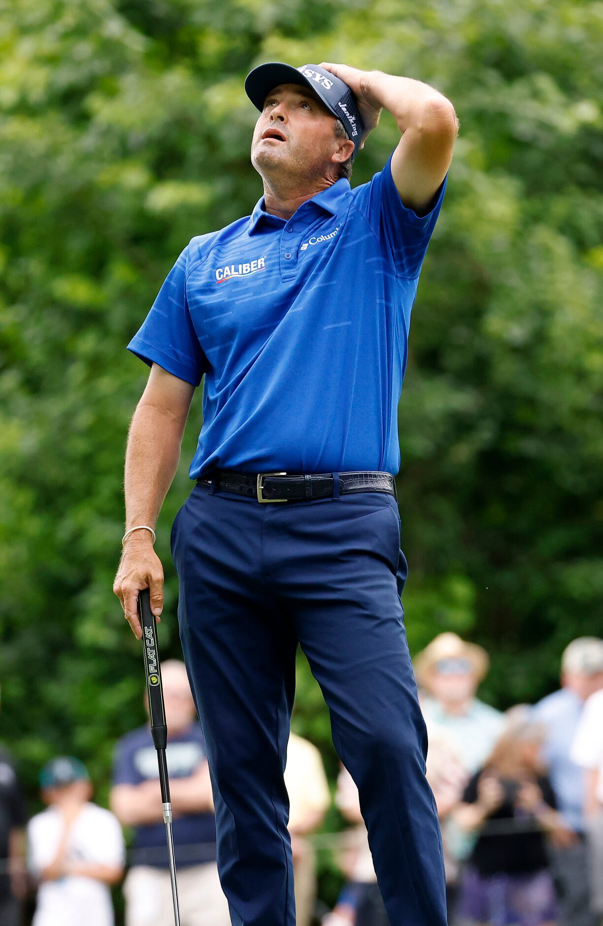 Professional golfer Ryan Palmer reacts after missing a birdie putt on the par-3, No. 8...