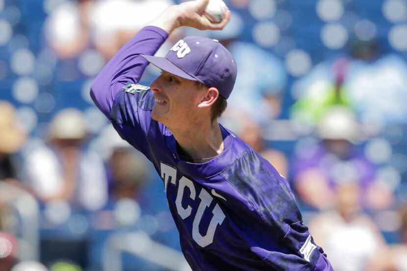TCU pitcher Brian Howard throws in the fourth inning of an NCAA College World Series...