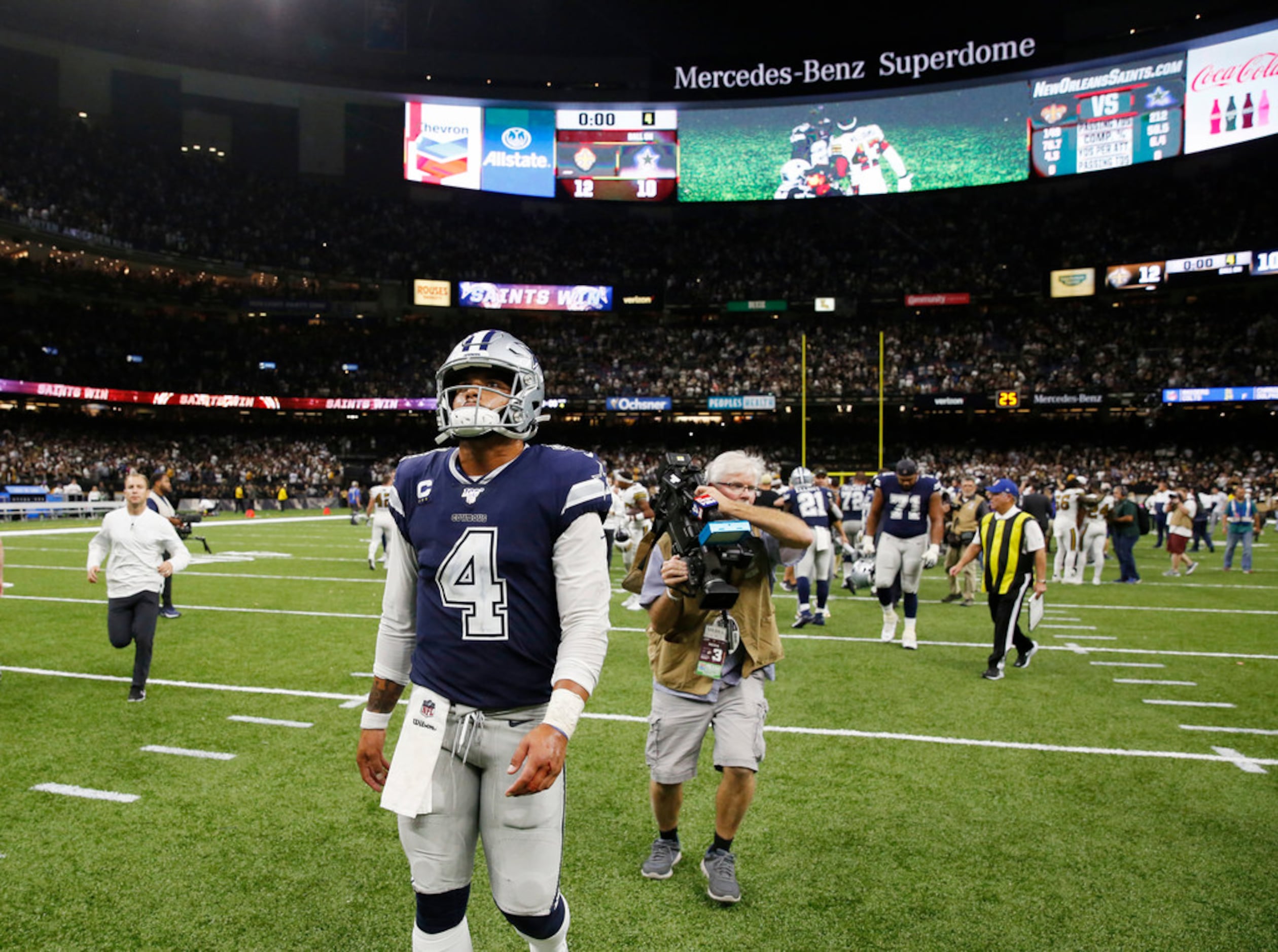 Dallas Cowboys quarterback Dak Prescott (4) walks off the field after losing to the New...