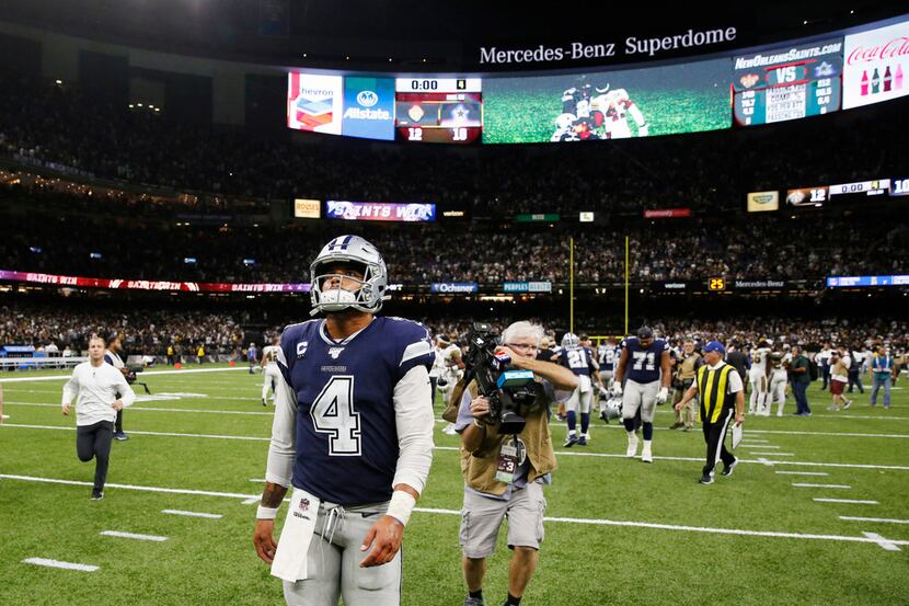 Dallas Cowboys quarterback Dak Prescott (4) walks off the field after losing to the New...
