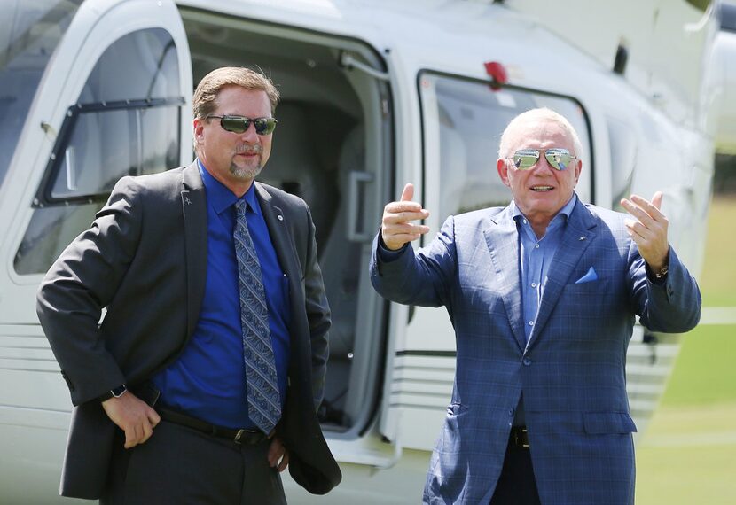 Dallas Cowboys owner Jerry Jones greets Treg Manning, Airbus vice president of sales and...