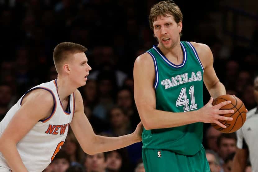 New York Knicks forward Kristaps Porzingis, left, defends Dallas Mavericks' Dirk Nowitzki...