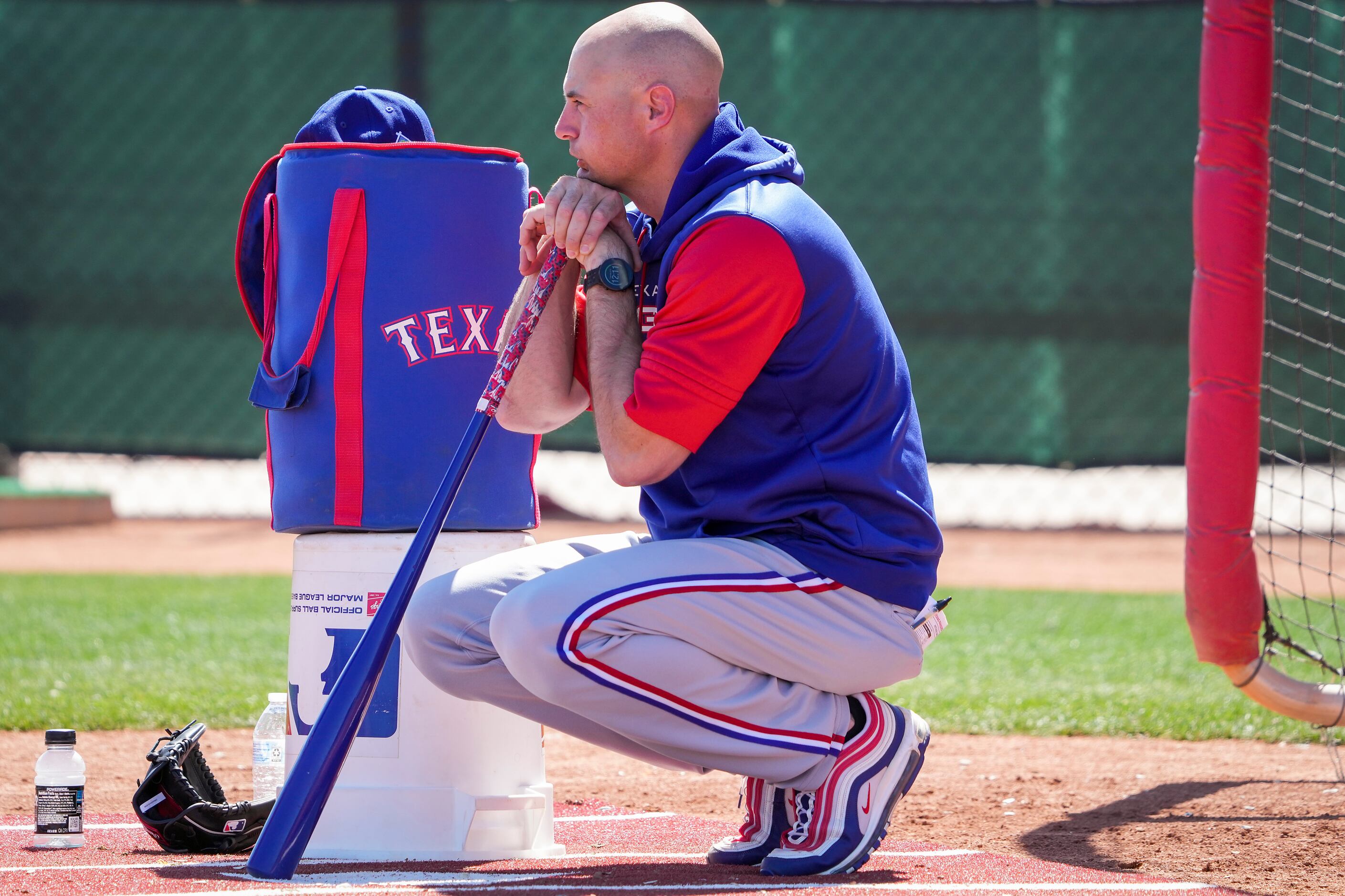 Texas Rangers Field Coordinator/First Base Coach Corey Ragsdale watchesduring a spring...