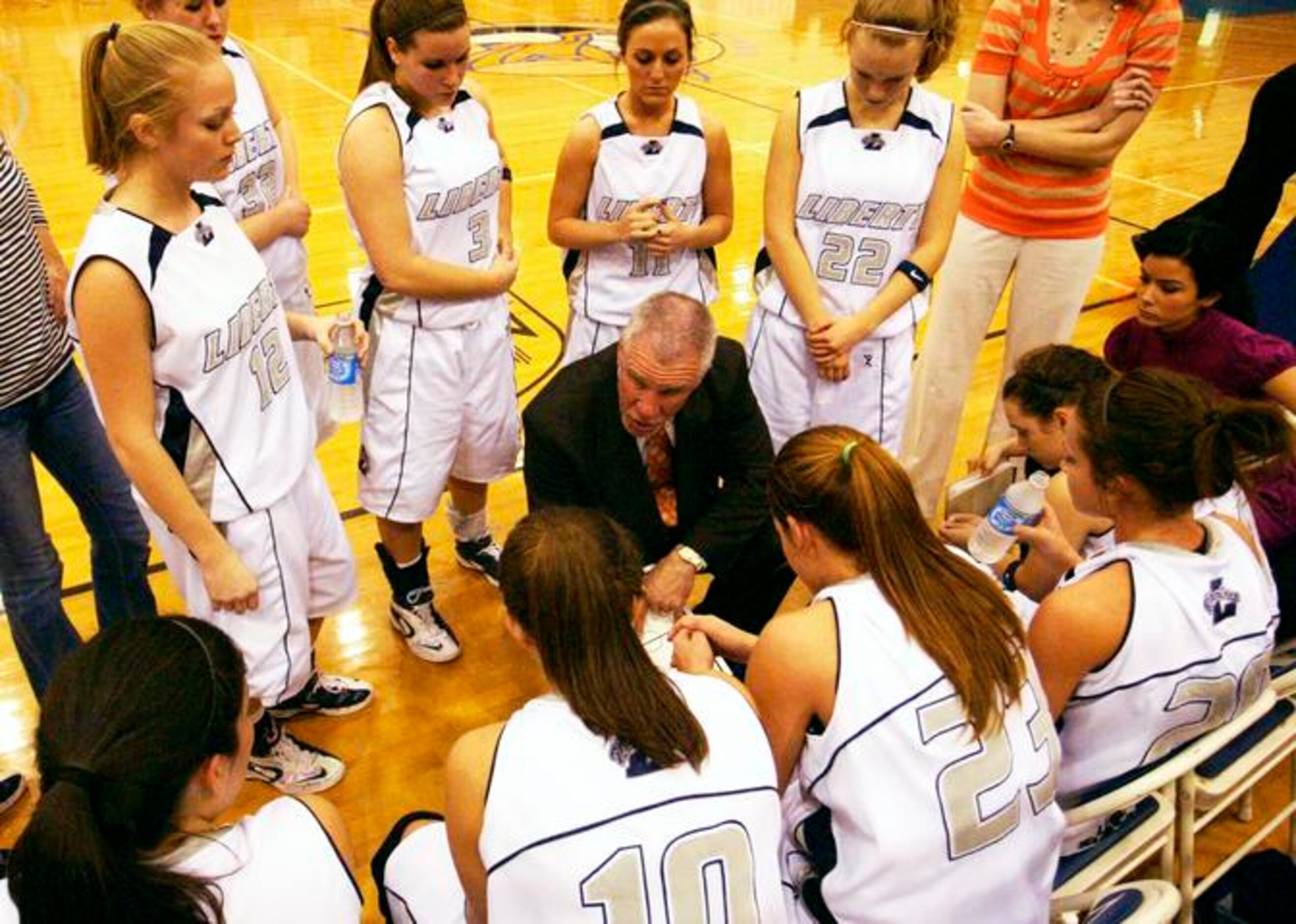 Argyle Liberty Christian coach Ken Burroughs talks with his team during a timeout against...