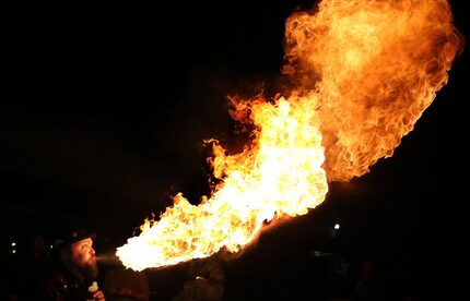 Fire breather Charlie Tips heats up the room at the 2014 event.