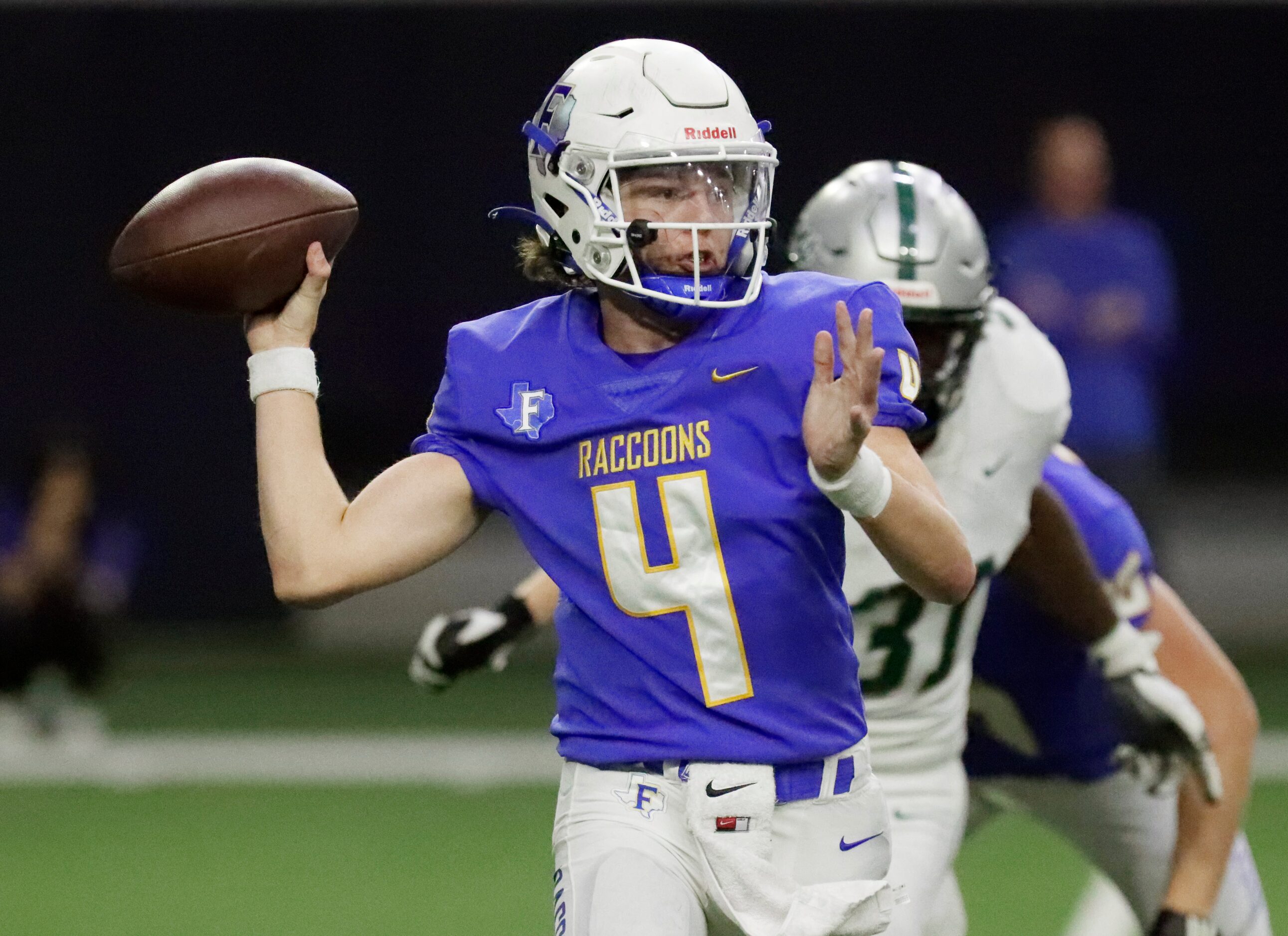 Frisco High School quarterback Camren Gibson (4) was pressured into throwing pick six on...