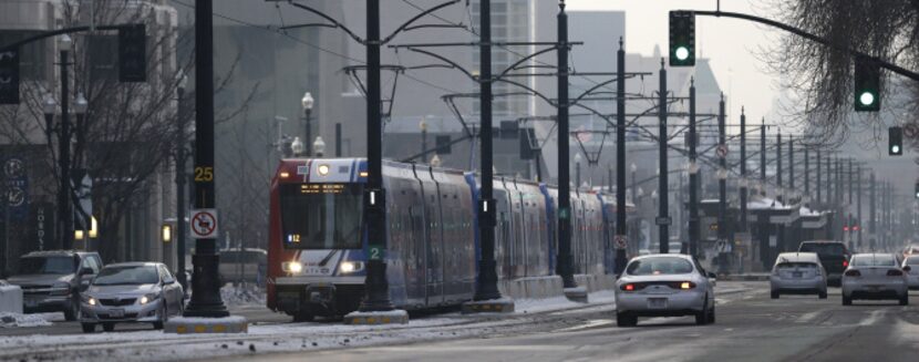 The light rail travels in downtown Salt Lake City Wednesday, Jan. 9, 2013. Built with the...