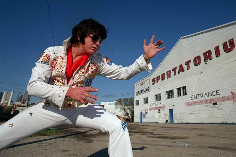 An Elvis impersonator posed outside the Sportatorium, where Elvis Presley played several...