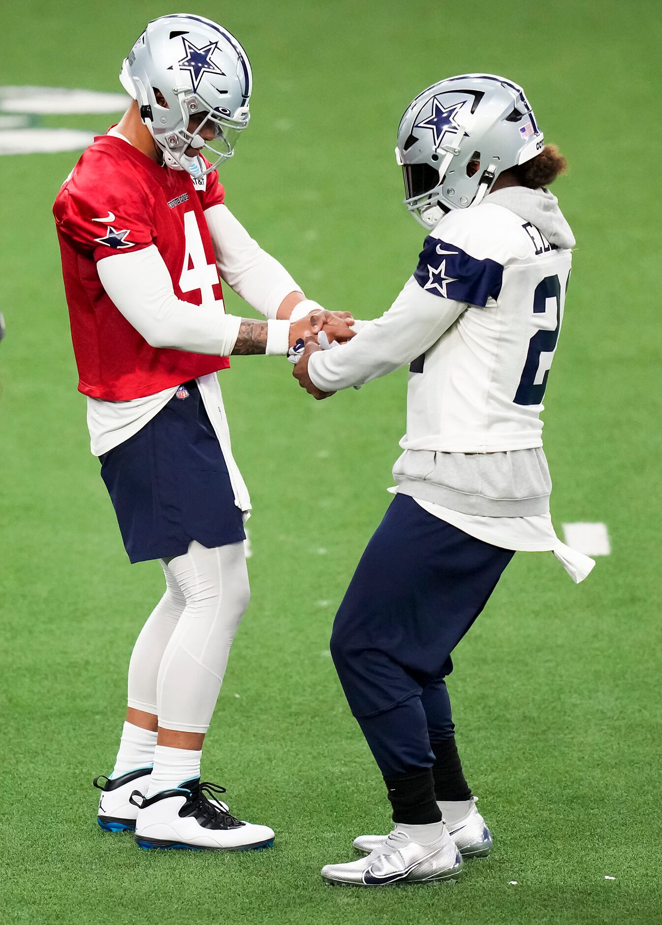 Dallas Cowboys quarterback Dak Prescott (4) does a brief dance with running back Ezekiel...