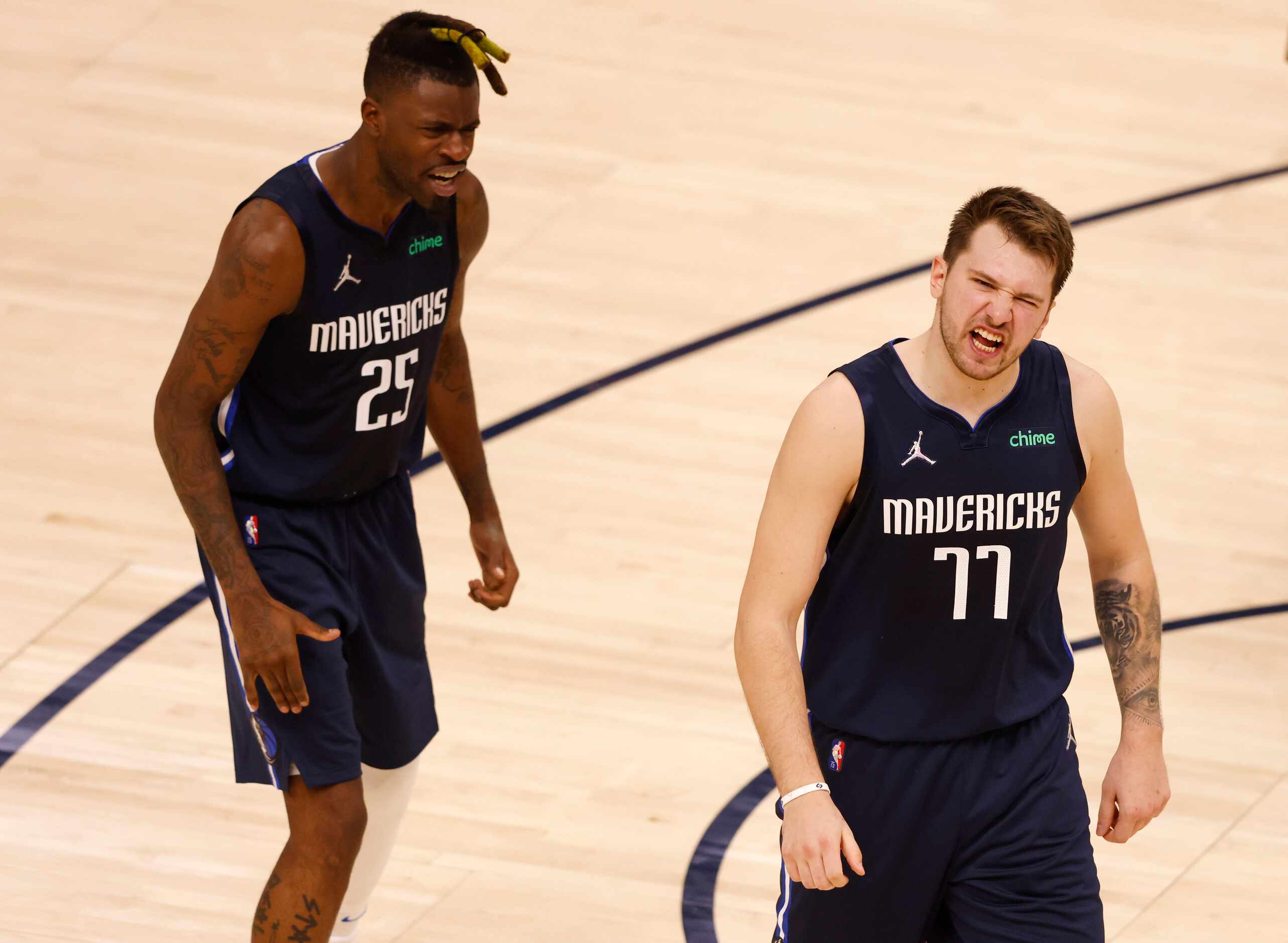 Dallas Mavericks guard Luka Doncic (77) celebrates Dallas Mavericks forward Reggie Bullock...