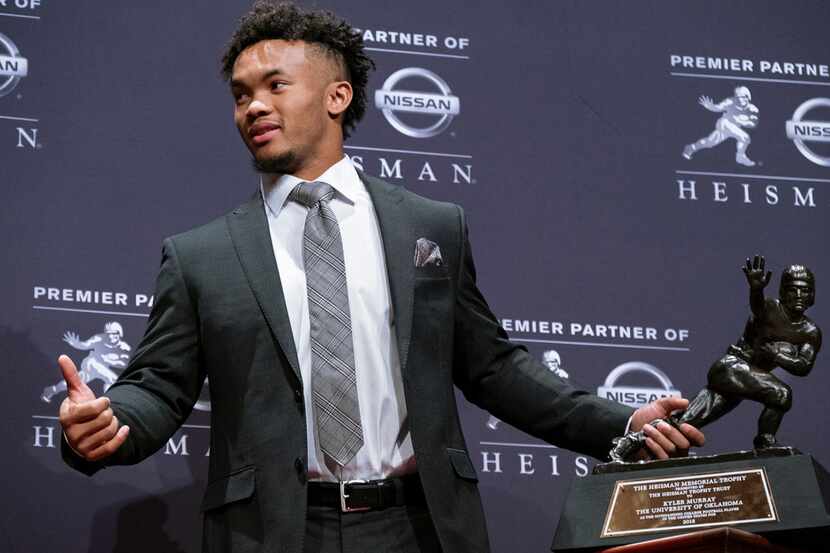 FILE - In this Dec. 8, 2018, file photo, Oklahoma quarterback Kyler Murray holds the Hesiman...