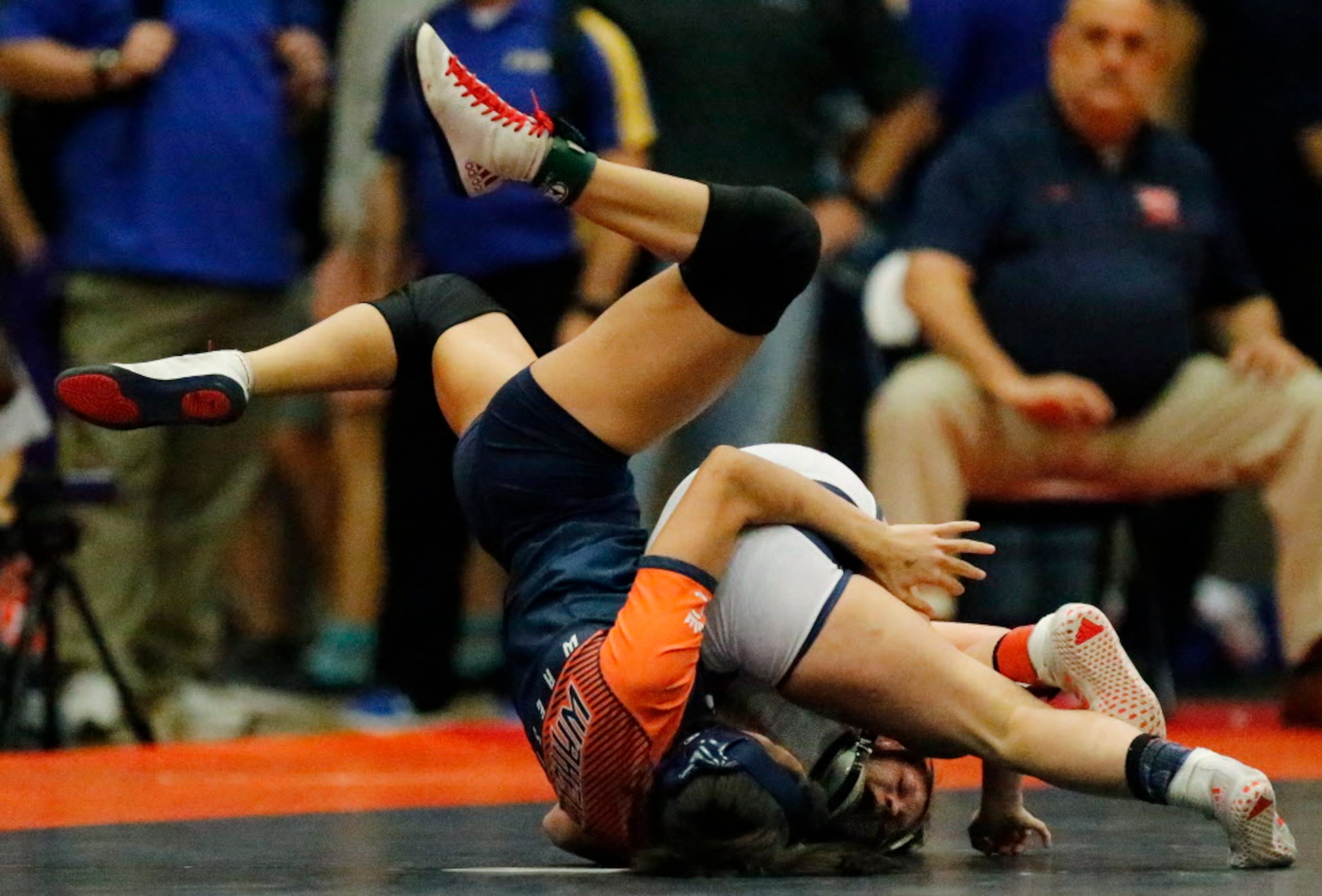 Frisco Wakelands Christina Nguyen flys through the air while wresting in her championship...