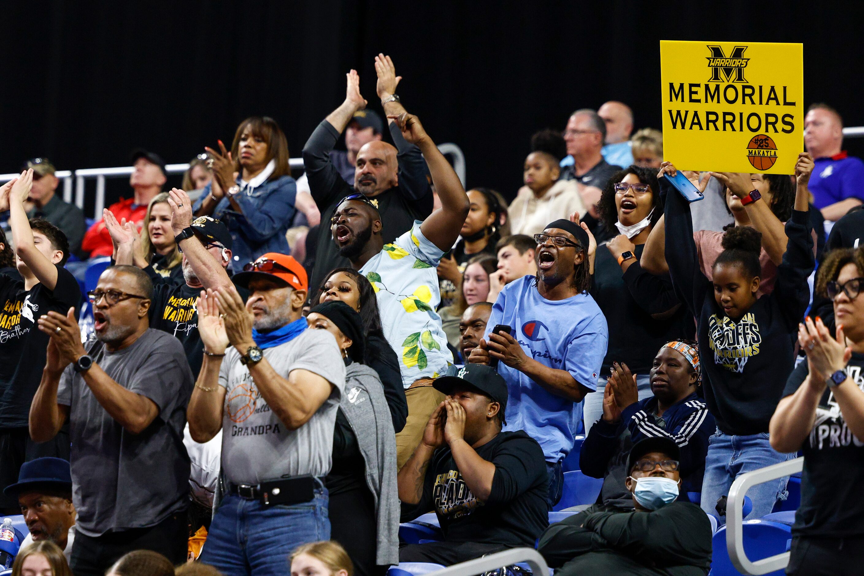 Frisco Memorial fans celebrate a basket late in the fourth quarter of the Class 5A state...