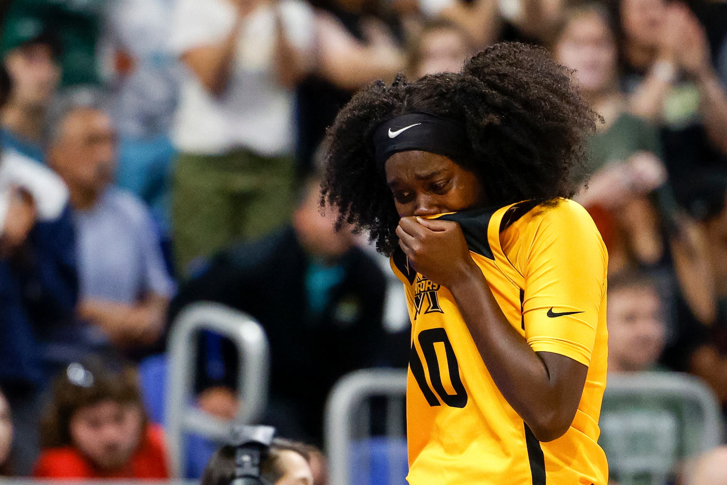 Frisco Memorial guard Jasmyn Lott (10) is overcome with emotion after fouling out during the...