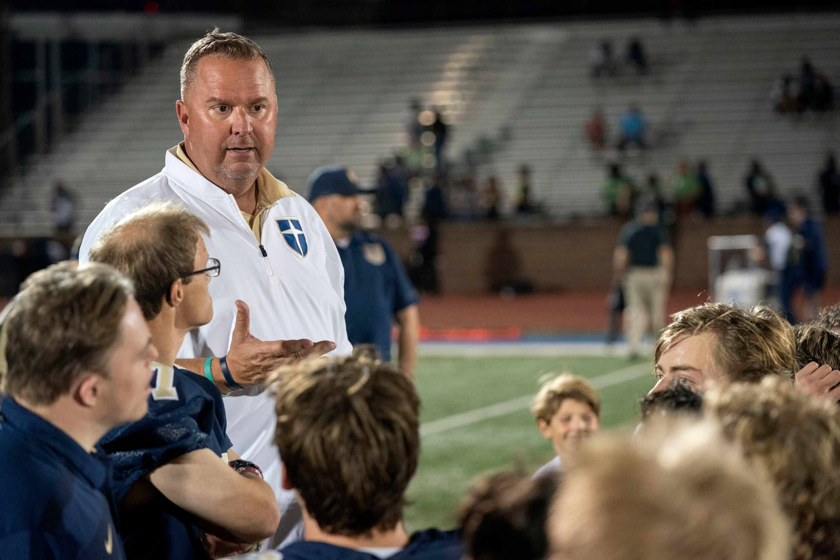Jesuit head coach Brandon Hickman talks to his team after their 37-0 victory over Richardson...