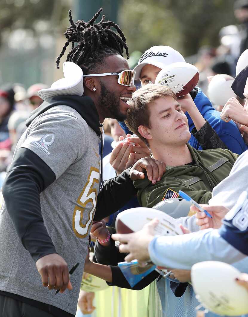NFC Team Dallas Cowboys linebacker Jaylon Smith has fun with fans during practice for the...