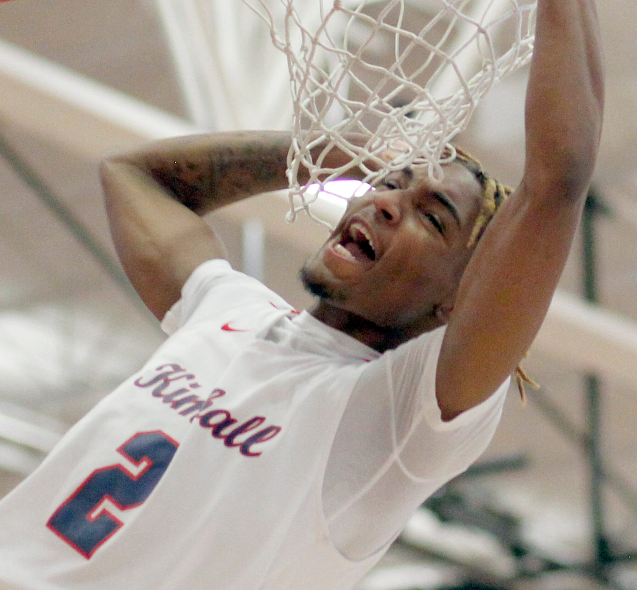 Kimball guard Arterio Morris (2) lets out a yell following a thunderous dunk during 2nd half...