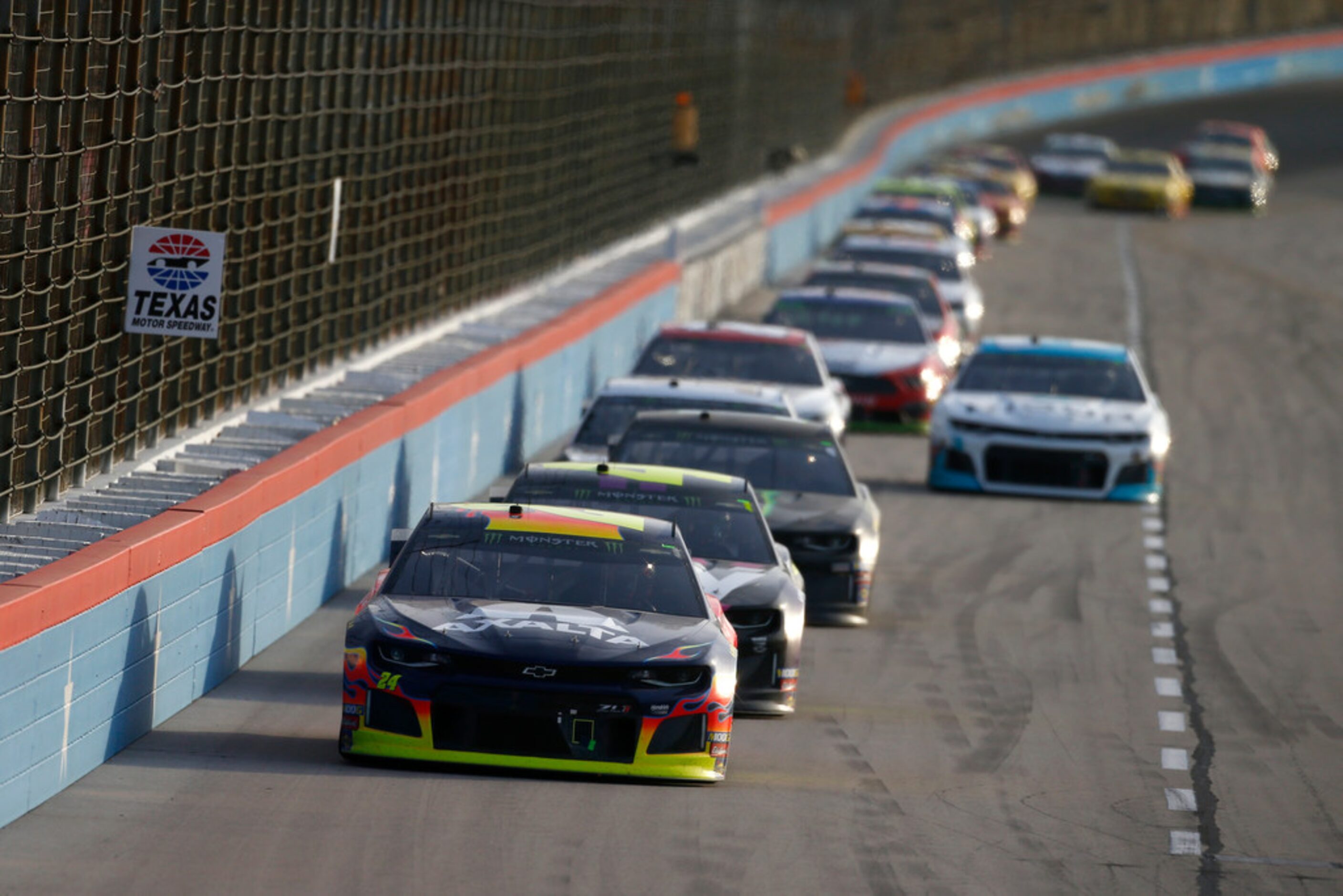 FORT WORTH, TEXAS - NOVEMBER 03: William Byron, driver of the #24 Axalta Chevrolet, leads a...