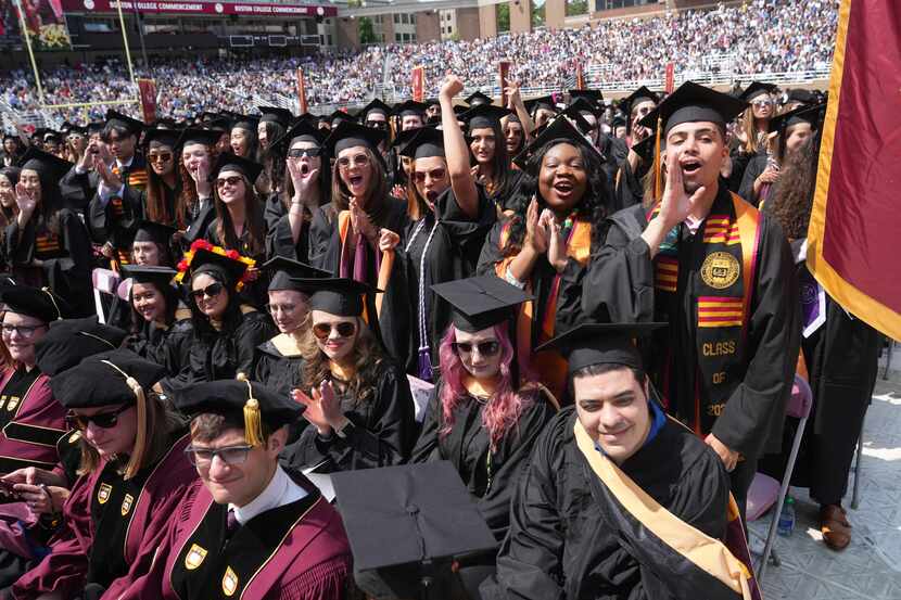 Graduating Boston College students cheer during commencement ceremonies on May 22, 2023, in...