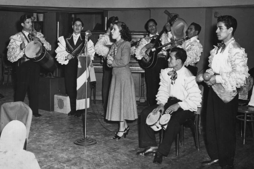 In 1940, the Joe Azcona Band performs in costume with a female guest singer.  The band was...