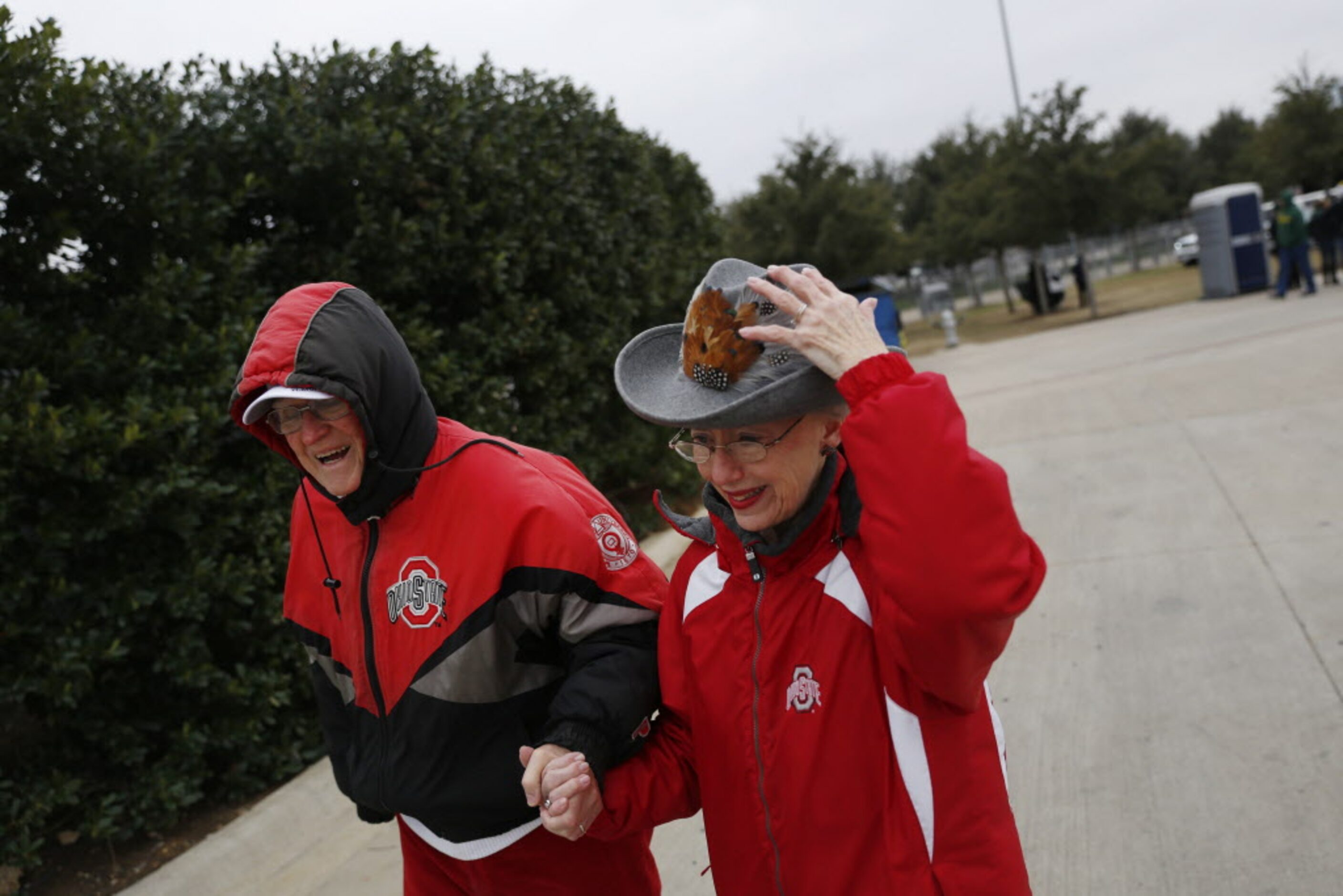 Ohio State Buckeyes fans Tom DiRosario and Maud DiRosario, of Columbus, Ohio, walk to the...