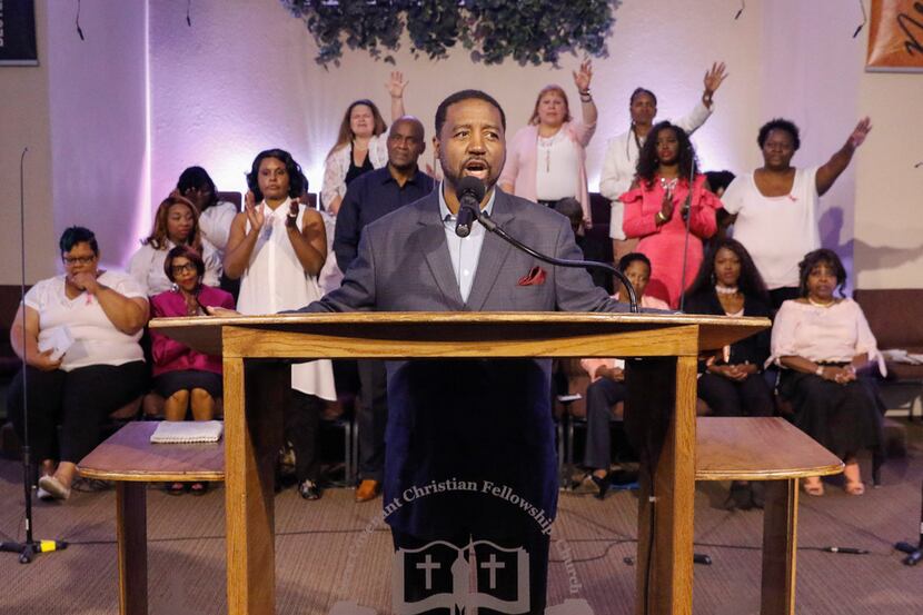 Pastor Andre Byrd Sr. speaks to the congregation, with the New Covenant Christian Fellowship...