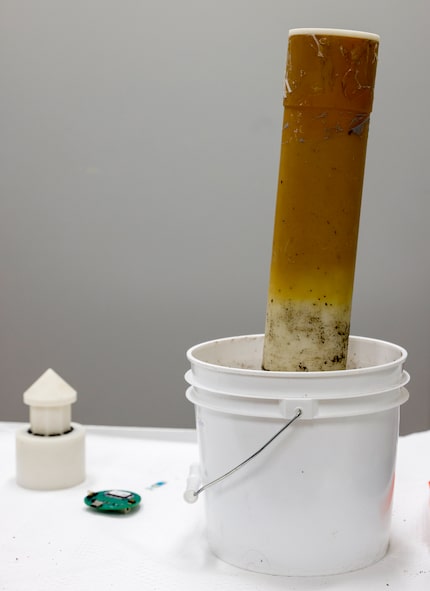 A probe measures the health of a bucket of soil in a lab at UT Dallas. The sensors in the...