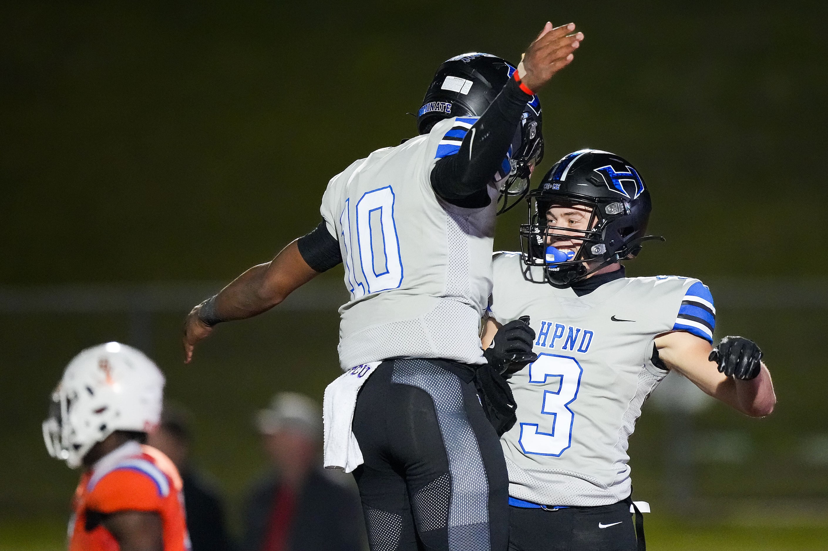 Hebron wide receiver Drew Koster (3) celebrates with quarterback Patrick Crayton Jr. (10)...