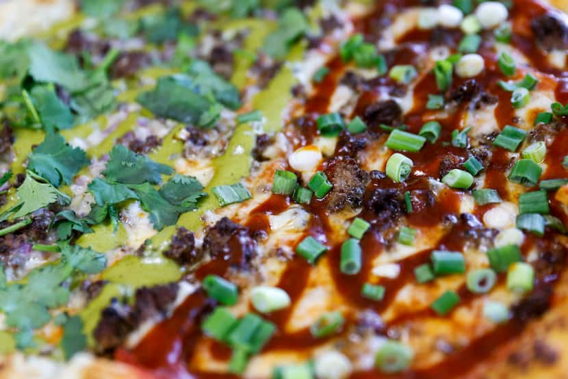 Beef Taco and Korean BBQ pizza at SauceBros Pizza on Thursday, April 11, 2024 in Plano. 