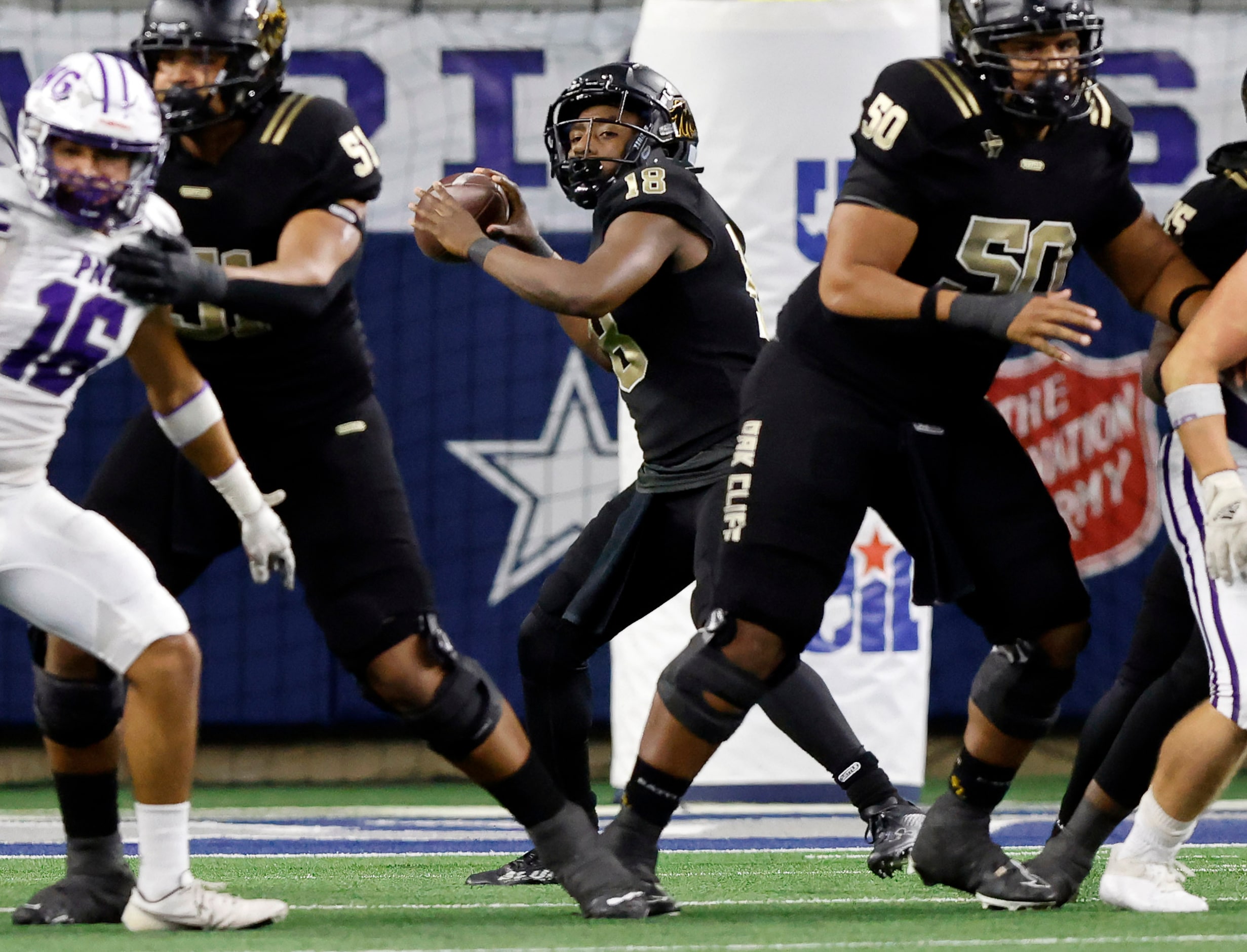 South Oak Cliff quarterback William Little (18) throws a deep pass to wide receiver Joshua...