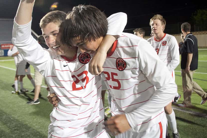 Coppell player Stephen Tower and Austin Michaelis embrace after their victory over...