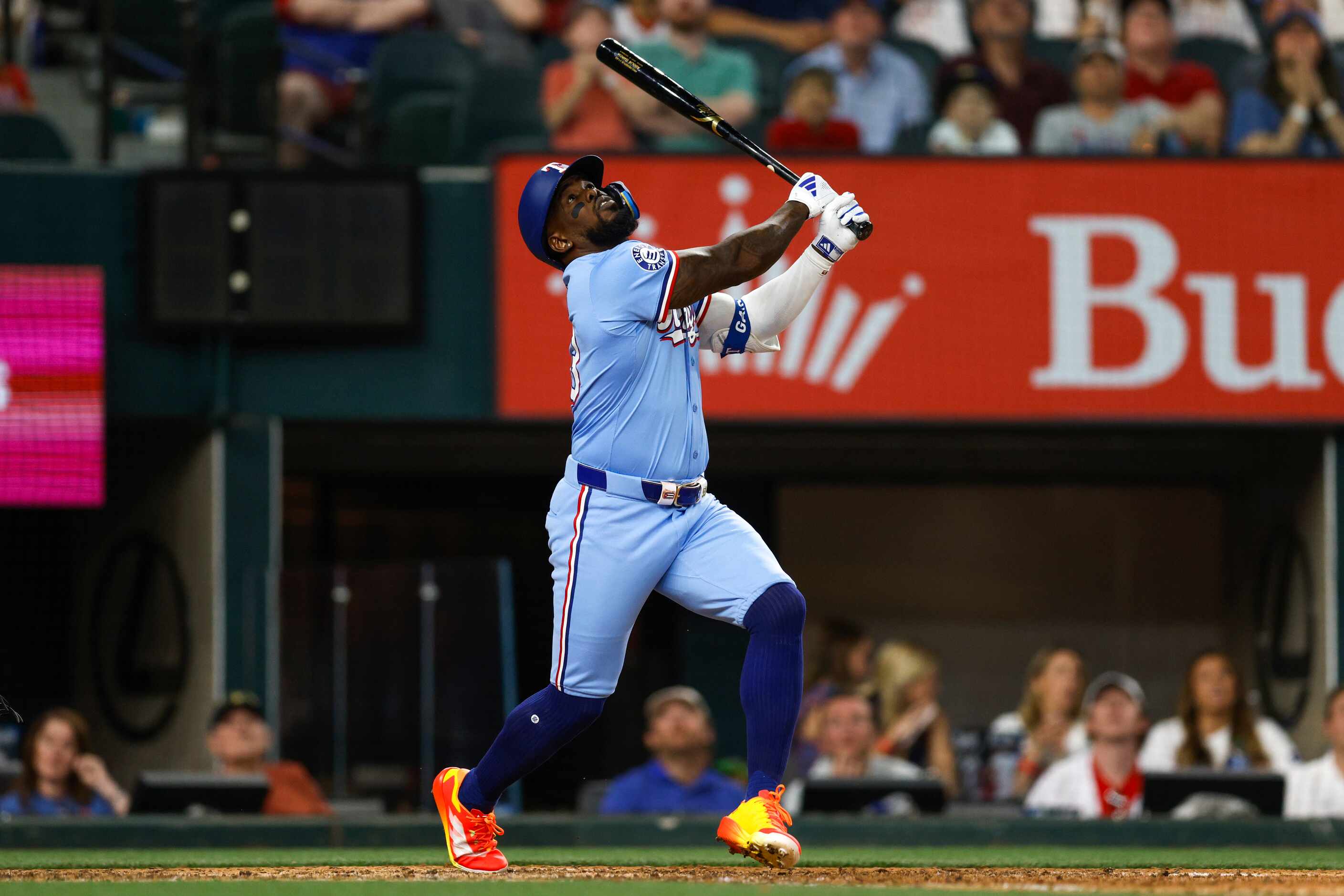 Texas Rangers right fielder Adolis García (53) looks up after hitting a foul ball during the...