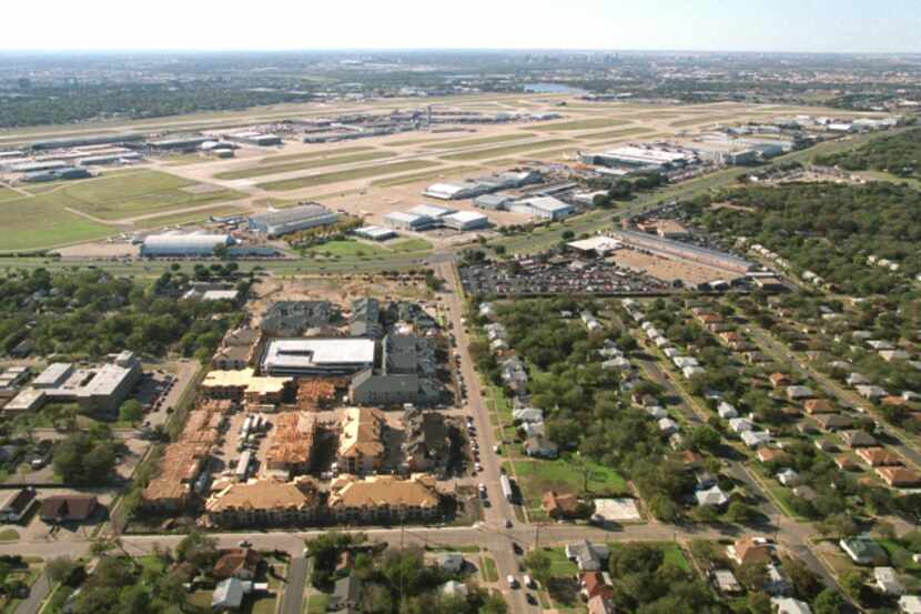 This aerial view shows homes located on the eastern edge of Love Field. The airport is...