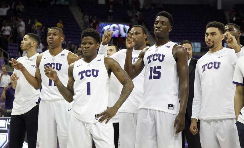 TCU Horned Frogs players listen to the school song following a 75-67 loss against Oklahoma...