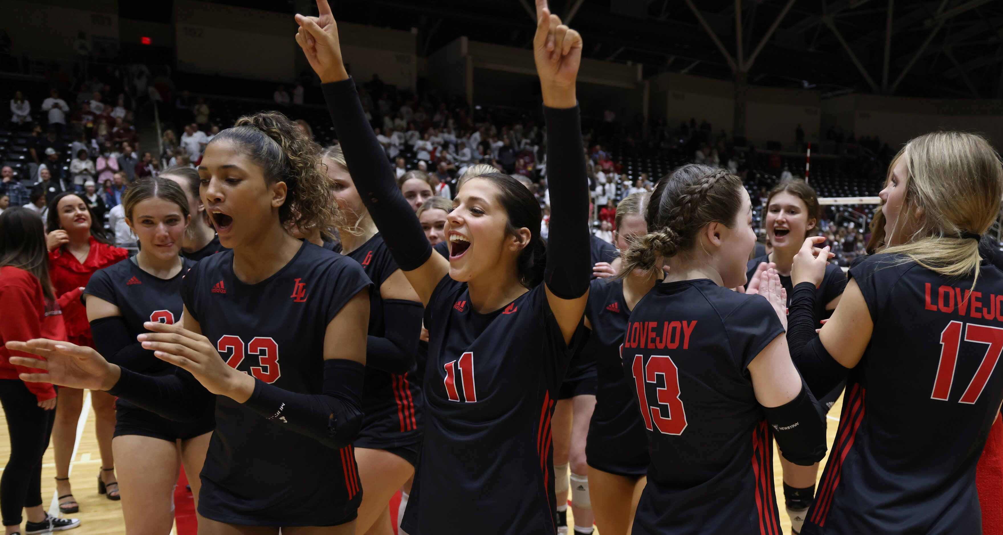 Lucas Lovejoy senior Isa Camacho (11), center, raises her arms as she celebrates with...