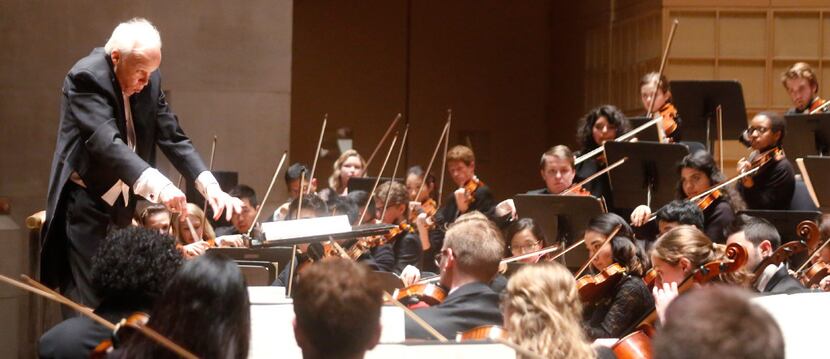 Dr. Paul Phillips, Director of the Meadow Symphony Orchestra conducts the opening number, La...
