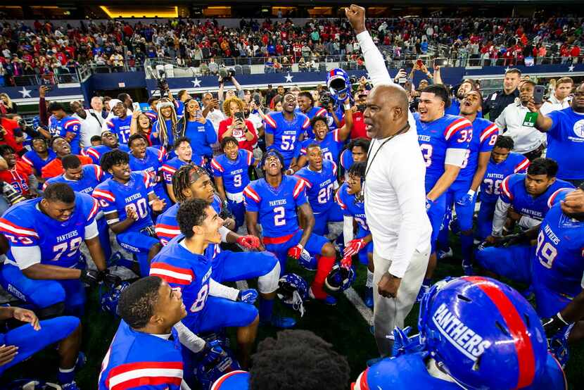 Duncanville players circle around head coach Reginald Samples after a 44-35 victory over...